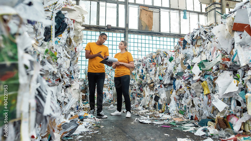 Fotografie Man working with girl on waste disposal station