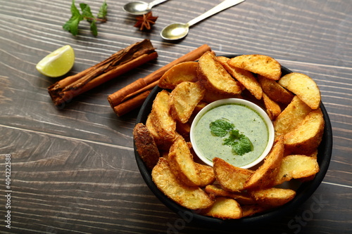 Crispy baked spicy and salted potato wedges.