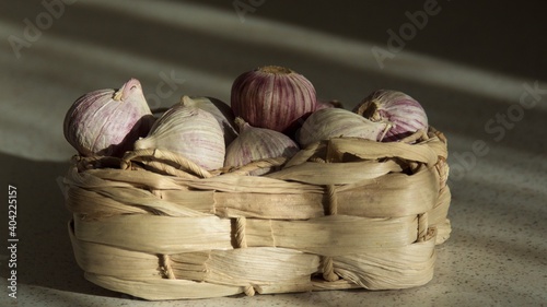 Garlic in basket to protect in coronatime photo