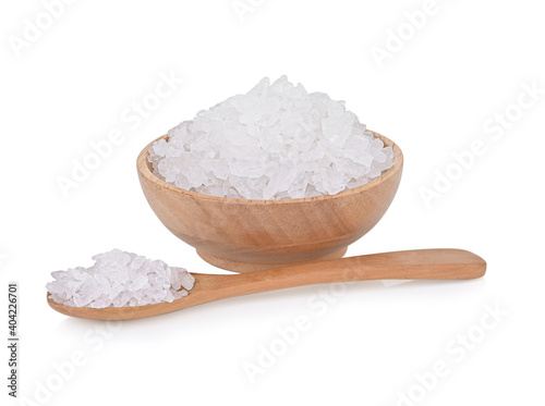 natural rock sugar in a wooden cup   isolated on white background.