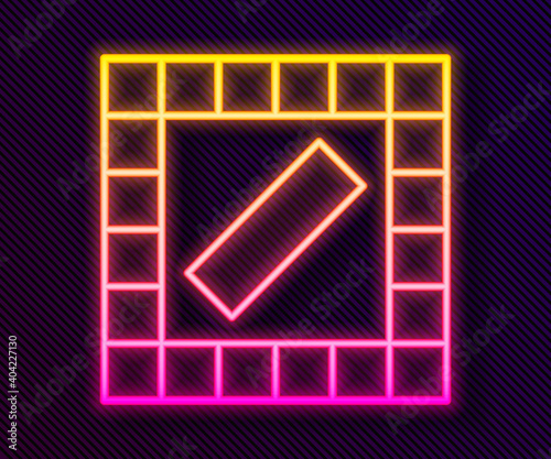 Glowing neon line Board game icon isolated on black background. Vector.