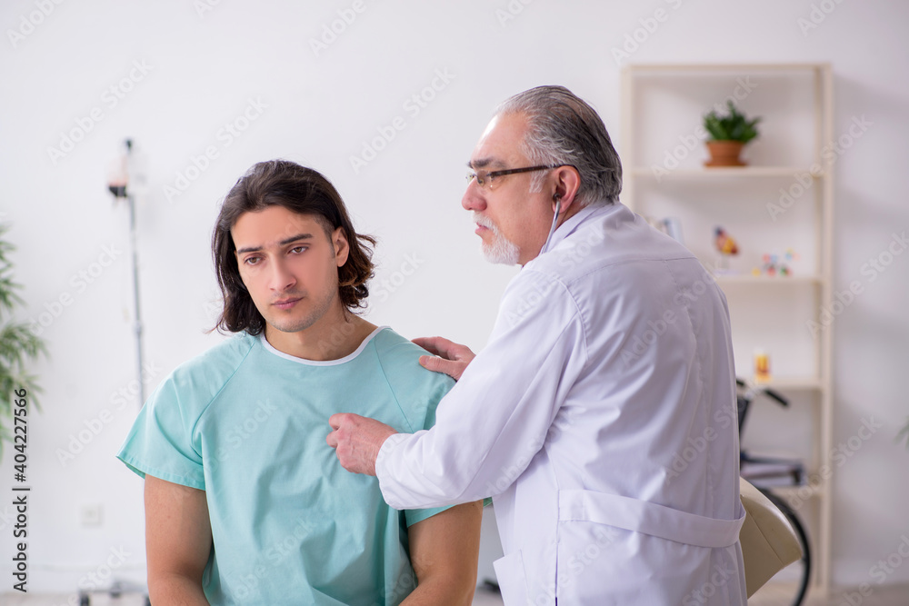 Fototapeta premium Young male patient visiting experienced doctor