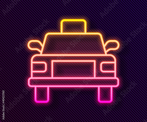 Glowing neon line Taxi car icon isolated on black background. Vector.