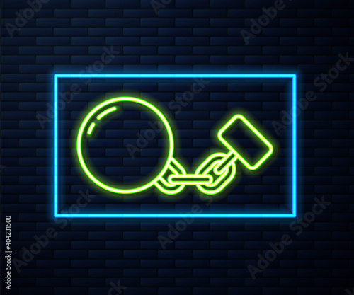 Glowing neon line Ball on chain icon isolated on brick wall background. Vector.