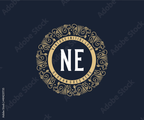 Initial NE Antique retro luxury victorian calligraphic emblem logo with ornamental frame.