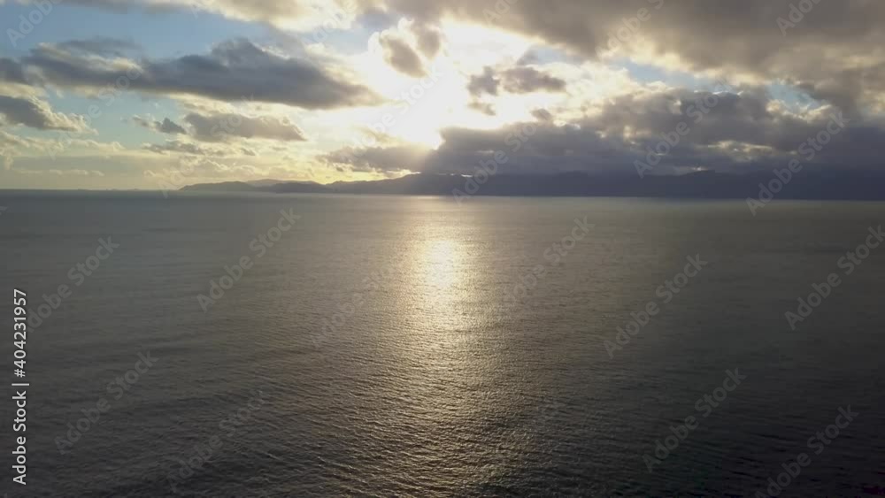 horizon on the shoreline of cagliari (calamosca) at sunset with clouds and calm sea during winter season. horizon on the shoreline of cagliari (calamosca) at sunset with clouds and calm sea during winter season.