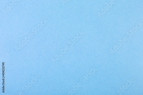 Close-up shot of light blue paper texture for background.