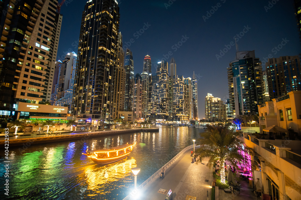 UAE, Dubai - December, 2020: Dubai Marina illuminated at night. United Arab Emirates