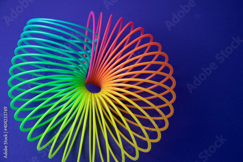Plastic  Magic Spring rainbow toy in colourful background with copy space for your own text, photography