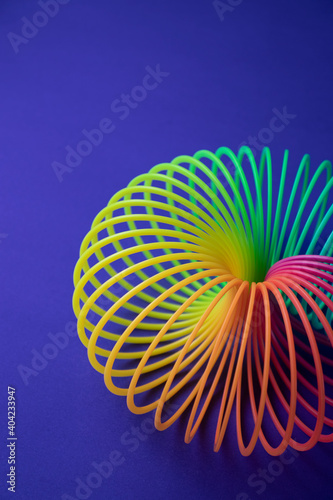 Plastic  Magic Spring rainbow toy in colourful background with copy space for your own text  photography