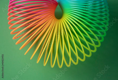 Plastic  Magic Spring rainbow toy in colourful background with copy space for your own text, photography