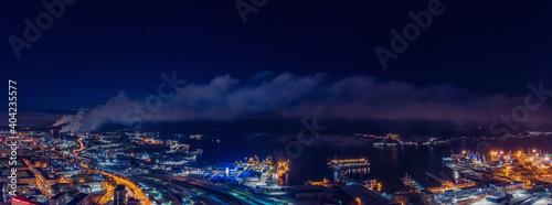 Murmansk, Russia Aerial view panorama of night city with Northern polar Lights aurora photo