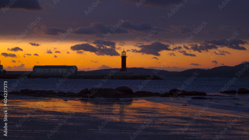 sunset over the sea lighthouse