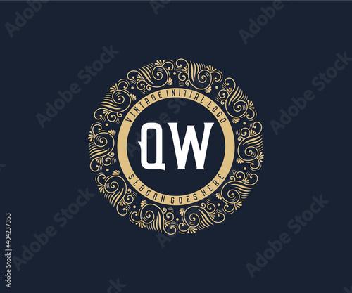 Initial QW Antique retro luxury victorian calligraphic emblem logo with ornamental frame. photo