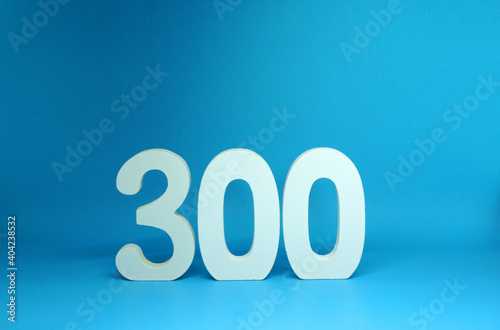 300 ( three hundred ) word Isolated Blue Background with Copy Space - Number 300% Percentage or Promotion - Discount or anniversary concept             