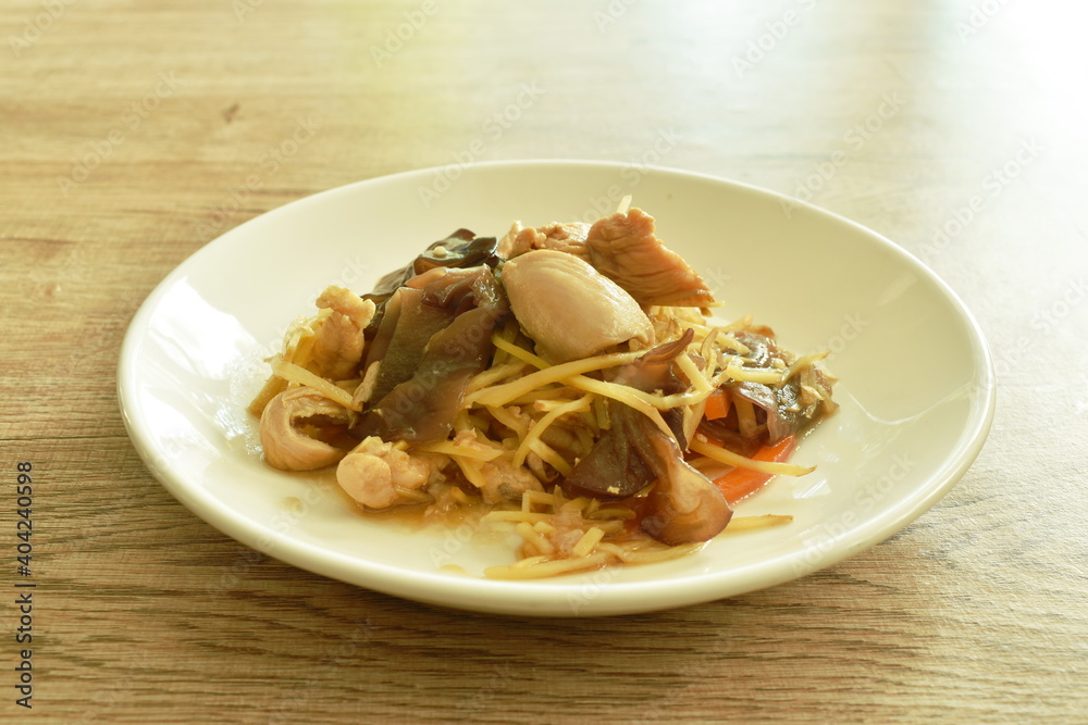 stir fried chicken with slice ginger and black ear mushroom on plate