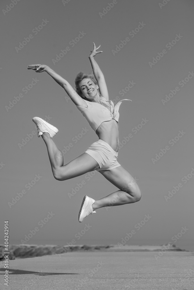 young slim athletic girl in jump