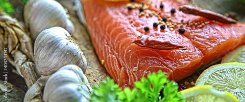 healthy delicious salmon with salt, lemon and salad photo