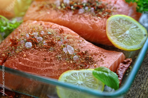 Obraz na płótnie healthy delicious salmon with salt, lemon and salad