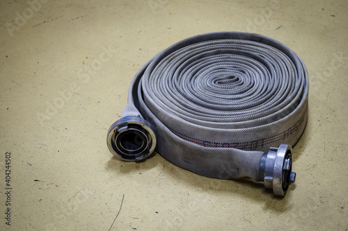 Twisted fire gray hose with end piece. 