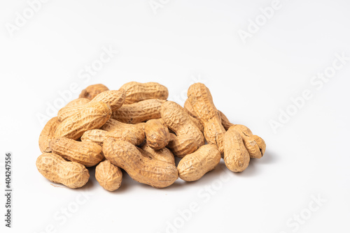 Dried peanuts in closeup isolated on white background. Copy space