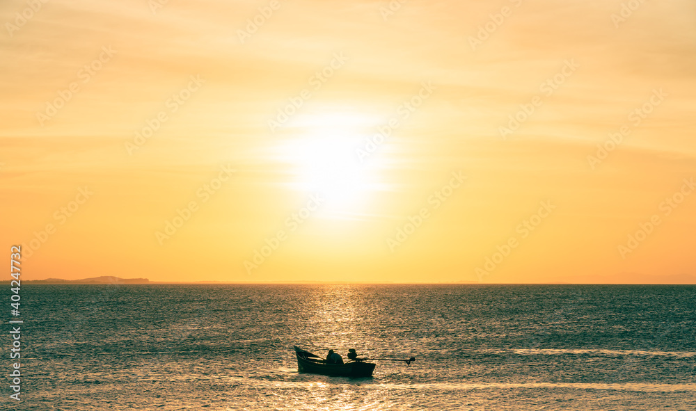 fishing boat in the sunset evening