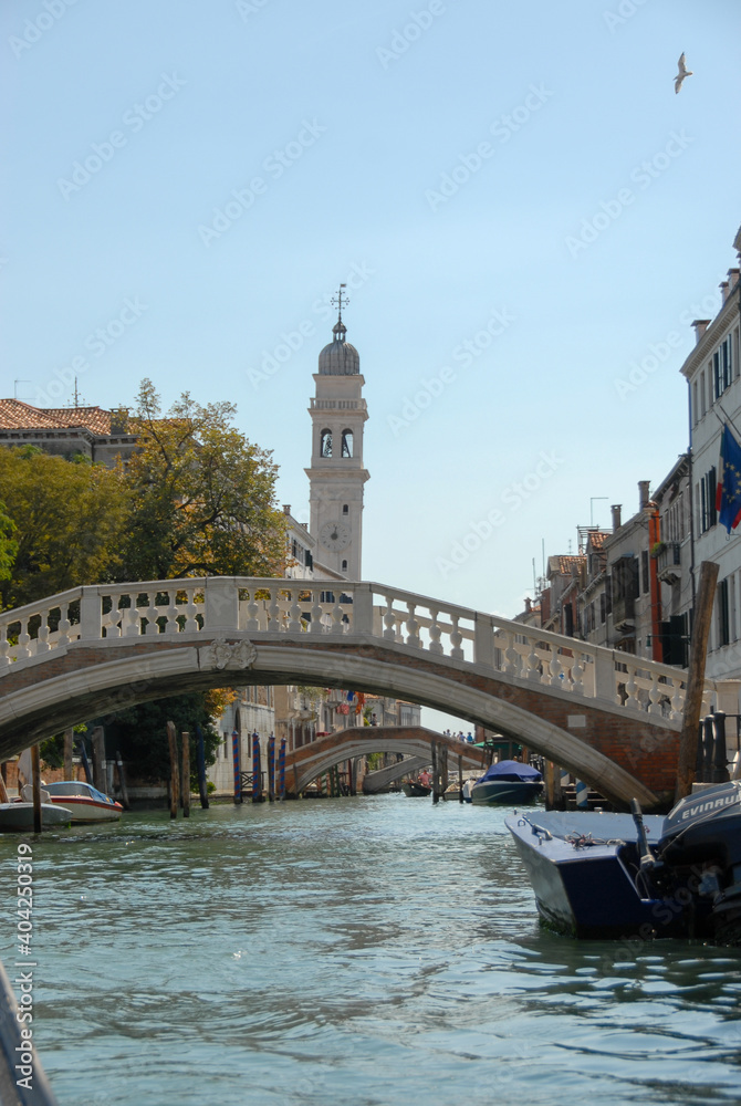Views traveling in gondola through the small canals of Venice Italy