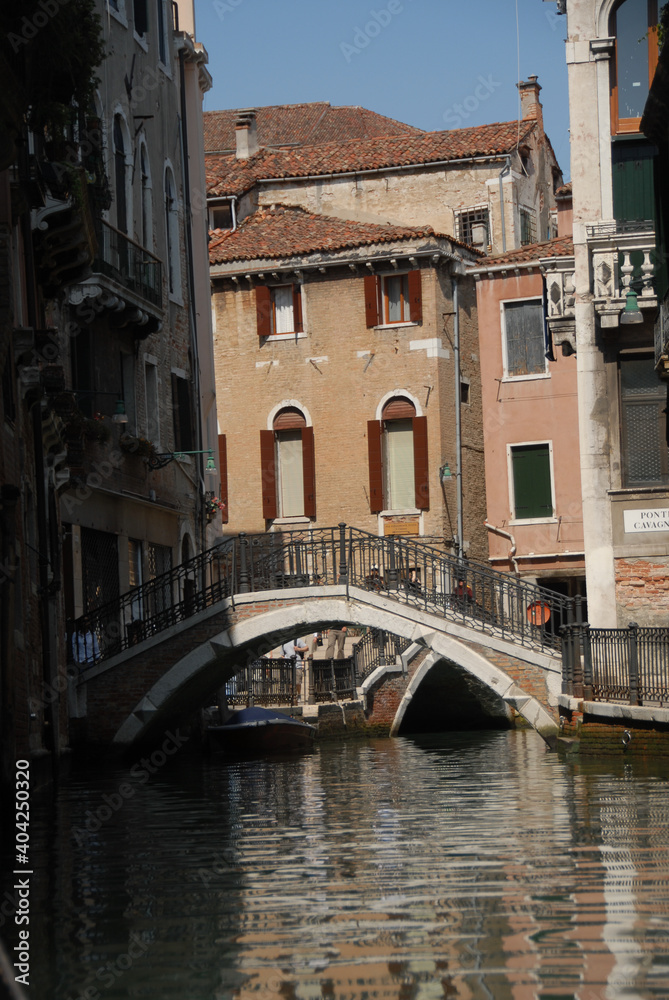 Views traveling in gondola through the small canals of Venice Italy