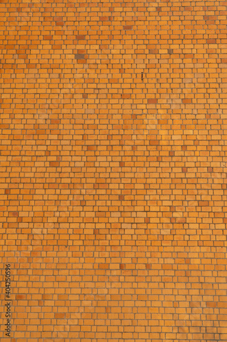 high wall of large brick. the concept of the construction