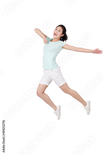 A happy Young woman in casual clothes jumping 