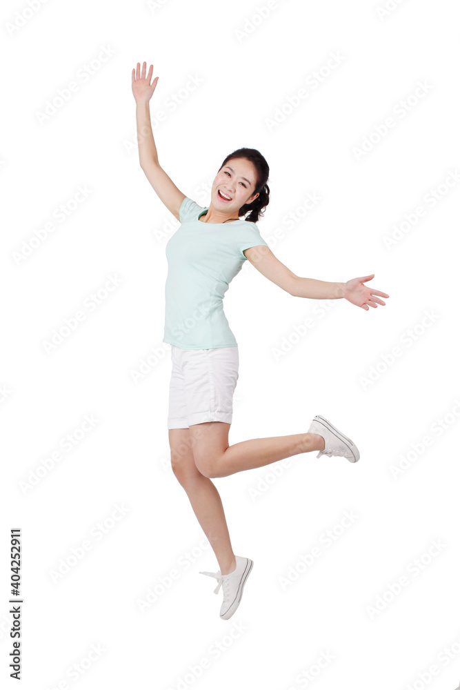 A happy Young woman in casual clothes jumping 