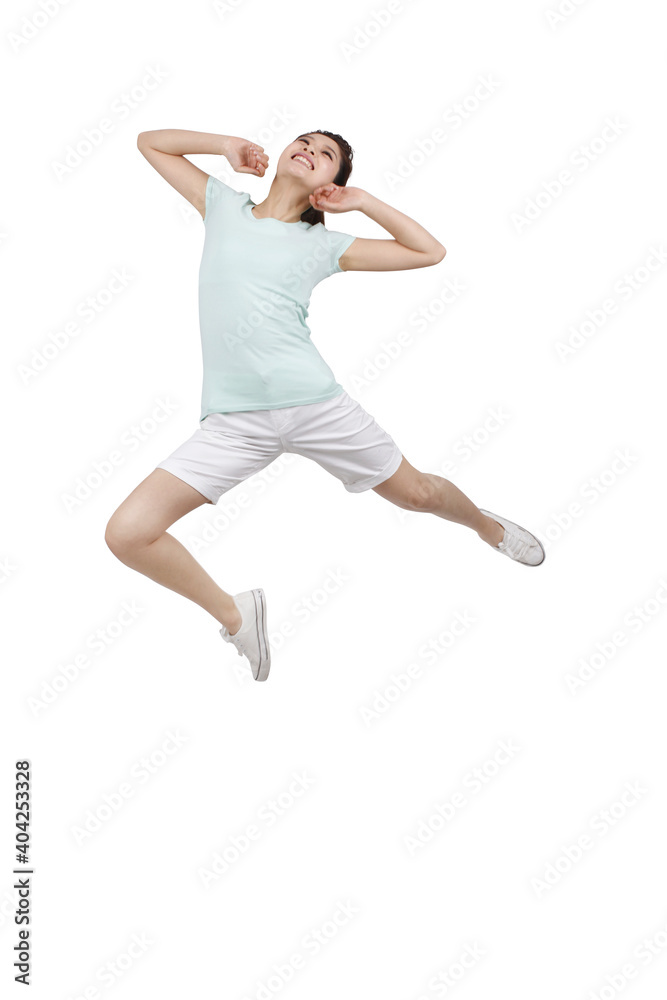 A young woman in casual dress jumped up