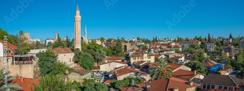 Panoramic view over the old historical downtown with many mosques in Antalya at blue sky and sunny day, Turkey.