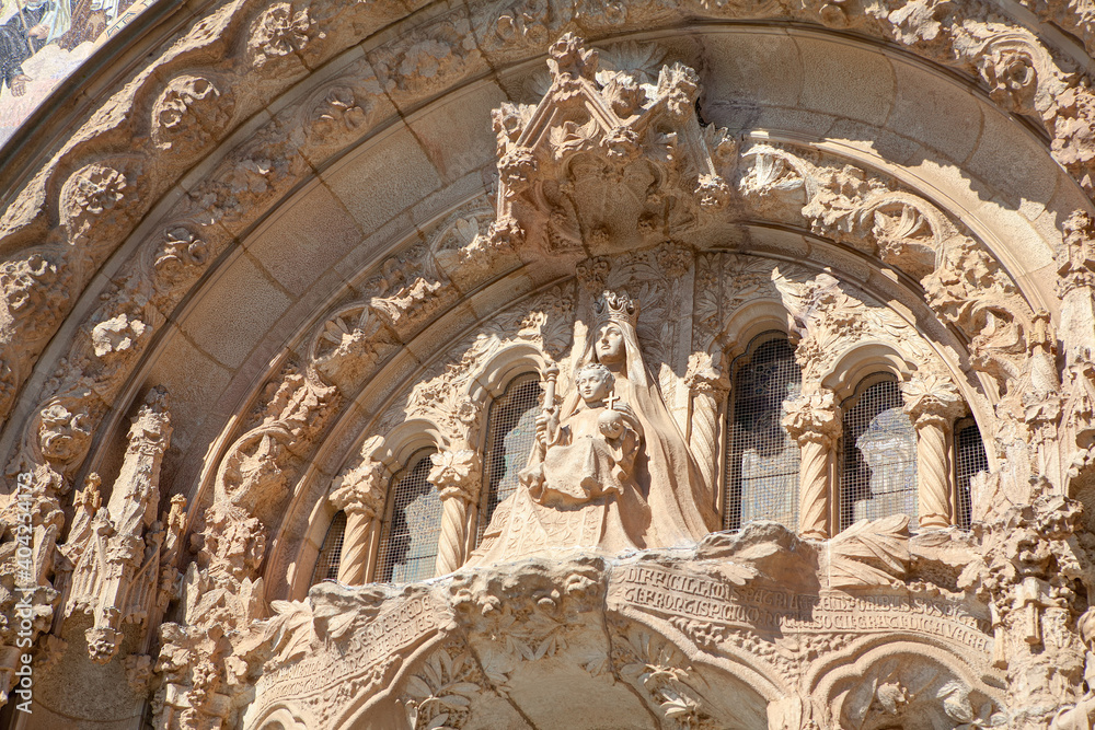 Cathedral Gothic Facade with Sculptures . Gothic style church architecture . Mother Mary with child 