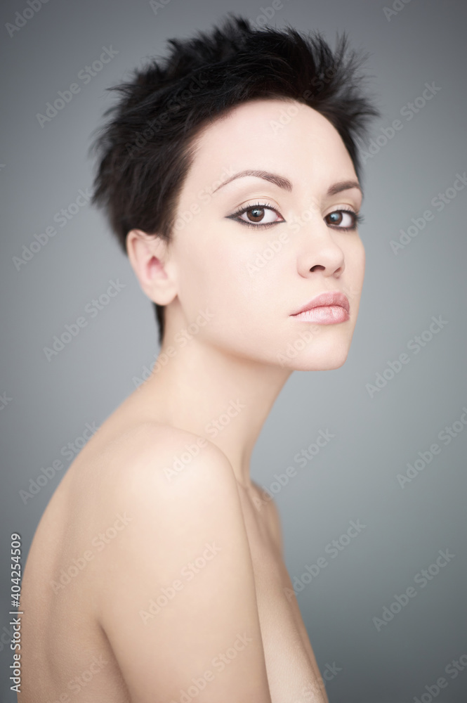 Fashion beautiful brunette with short haircut. studio portrait Fashion beautiful brunette with short haircut. studio portrait