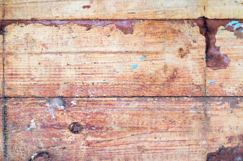 old wooden floor with scraped brown paint