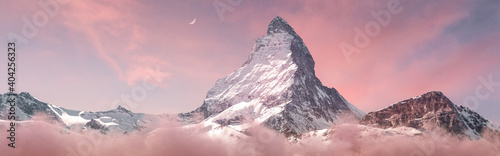 panoramic view to the majestic Matterhorn mountain in the evening mood photo