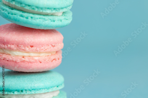 Fototapeta Naklejka Na Ścianę i Meble -  Colorful sweet macarons on a blue background