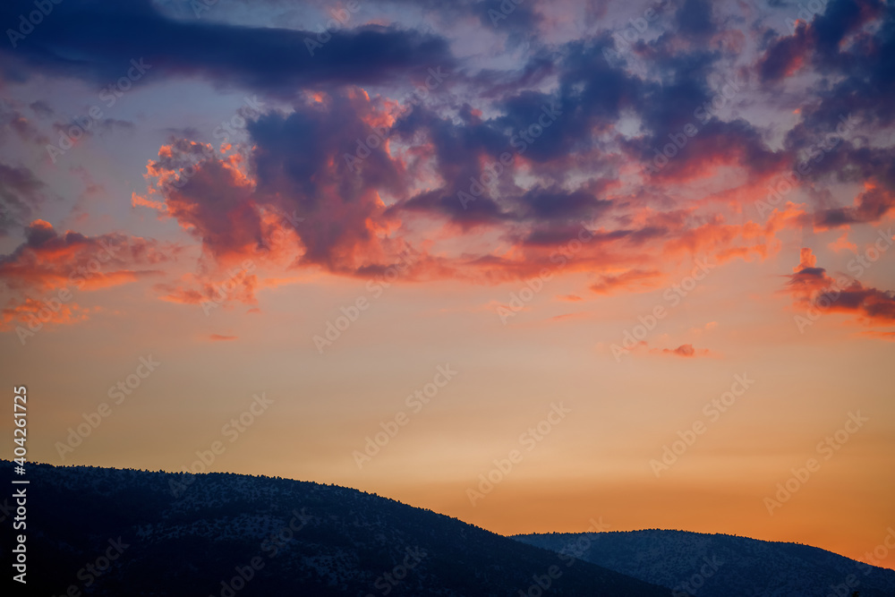 Dramatic sunset in cloudy weather. Horizontal landscape shot. High quality image.