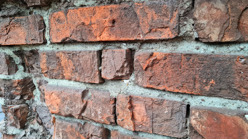 Texture of old red brick wall close-up.