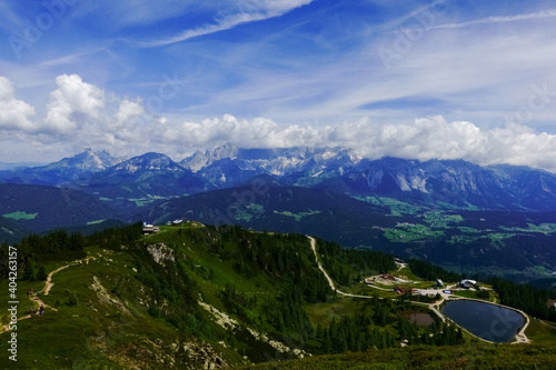 long path to a mountain lake while hiking in the summer