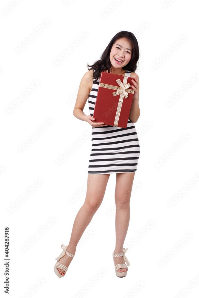 Young woman in a striped dress holding gift box Young woman in a striped dress holding gift box