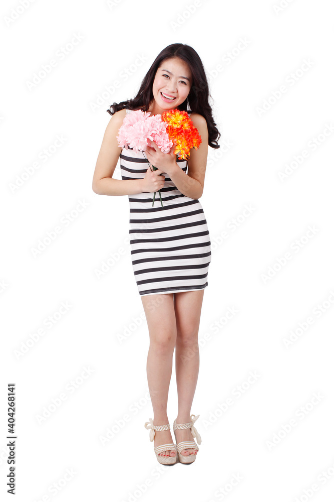 Young woman in a striped dress holding flowers Young woman in a striped dress holding flowers
