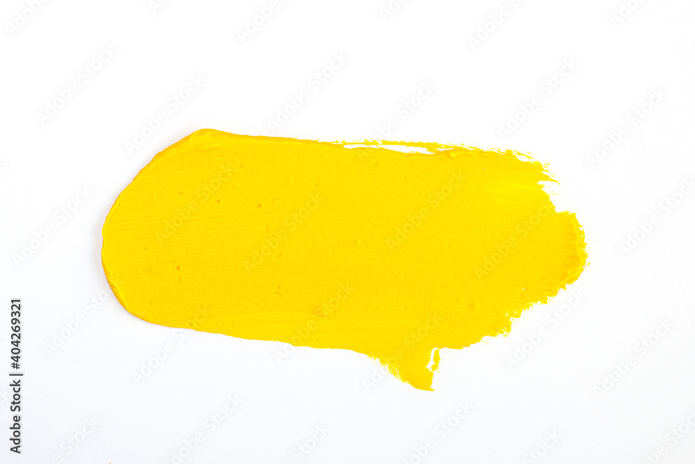 a smear of yellow paint isolated on a white background a smear of yellow paint isolated on a white background