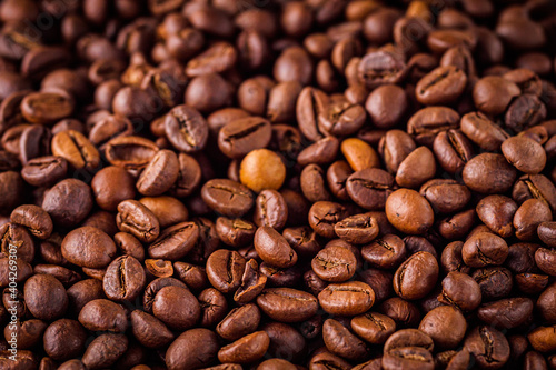 aromatic fresh coffee beans on a white wooden rustic background