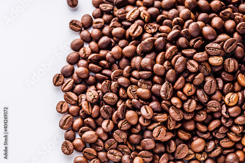 aromatic fresh coffee beans on a white acrylic background