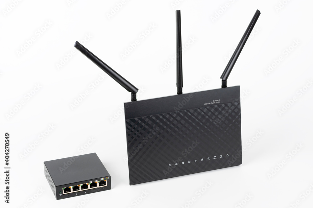 Fototapeta premium 5-port gigabit desktop switch and dual-band gigabit Wi-Fi router. Components to create a fast computer network