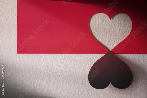 Love and Relationship Concept. Heart Shape on Red Paper hanging on the wall