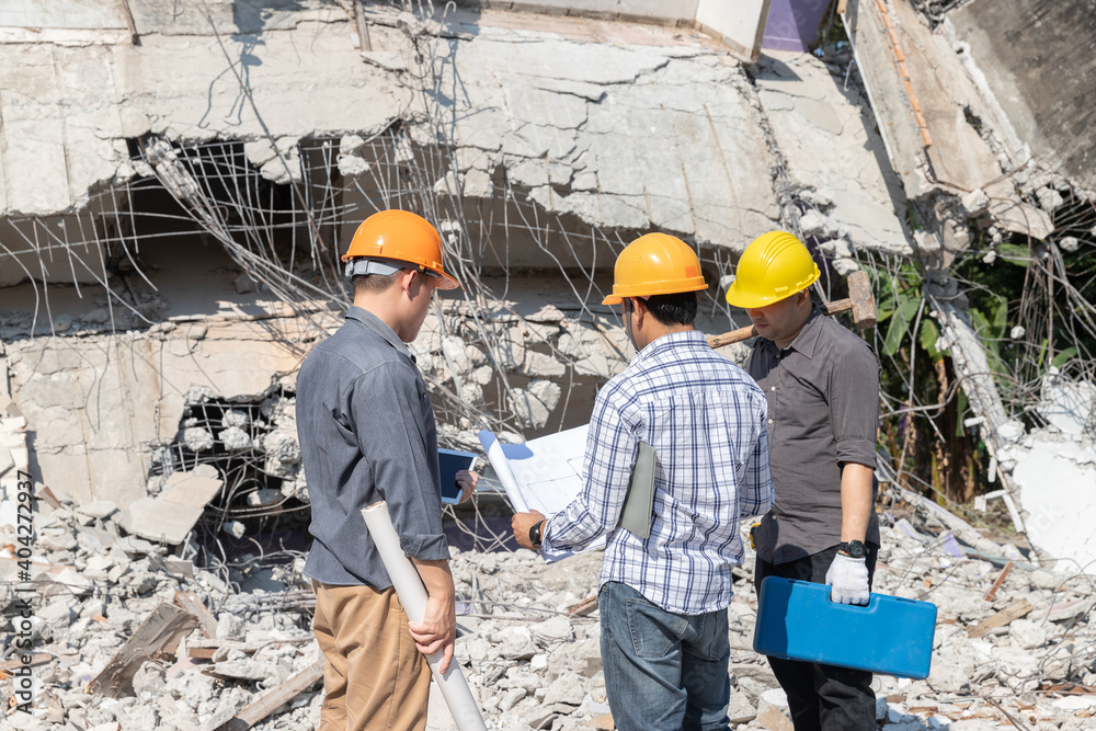 Demolition control supervisor and contractor discussing on demolish building. Demolition control supervisor and contractor discussing on demolish building.
