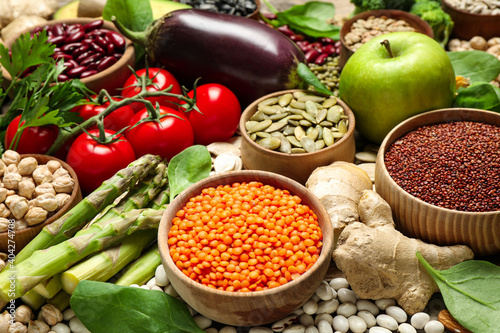 Different vegetables, seeds and fruits as background, closeup. Healthy diet